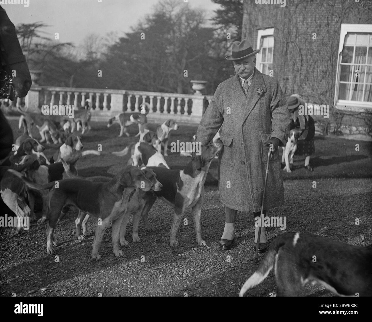 Meet of the Hertfordshire Hunt at Brocket Hall , near Hatfield . Sir Charles Nall Cain with the hounds . 12 February 1925 Stock Photo