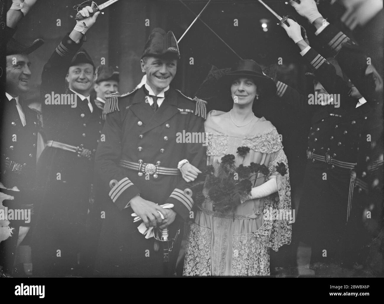 Guard of Honour at wedding of Rugby International . Commander N A Wodehouse , RN , the old International and Navy Rugby forward , and Mrs Douglas Swire , were married at St Martin 's in the Fields . Bride and Bridegroom . 22 October 1923 Stock Photo