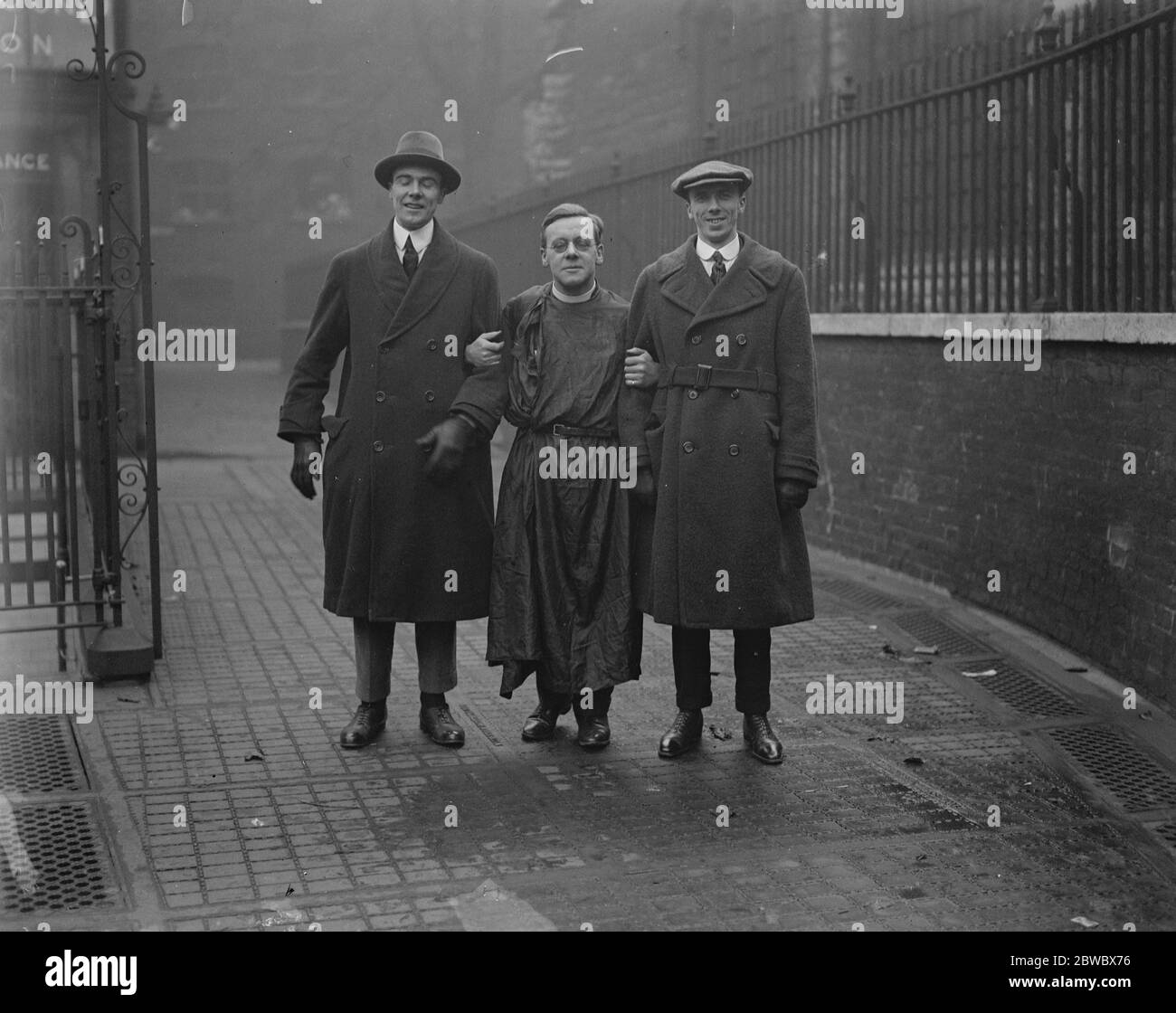 Toc H  members attend divine service . Rev T Clayton , known as  Tubby  , the  Toc H  padre with two of the Canadian delegates ( on left ) Whitehead from Montreal and Lee of Winnipeg . 16 December 1922 Stock Photo