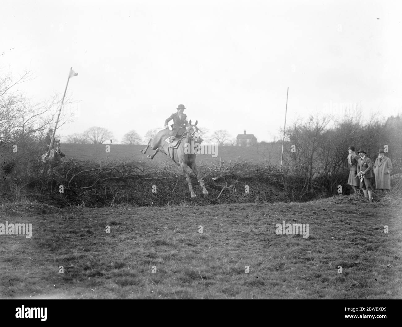 Ladies point to point race . The South and West Wilts Hunt point to point races at East Knoyle on Saturday included a ladies race for members of adjacent hunts . Mrs Guthrie taking a fence in splendid style . 6 March 1926 Stock Photo