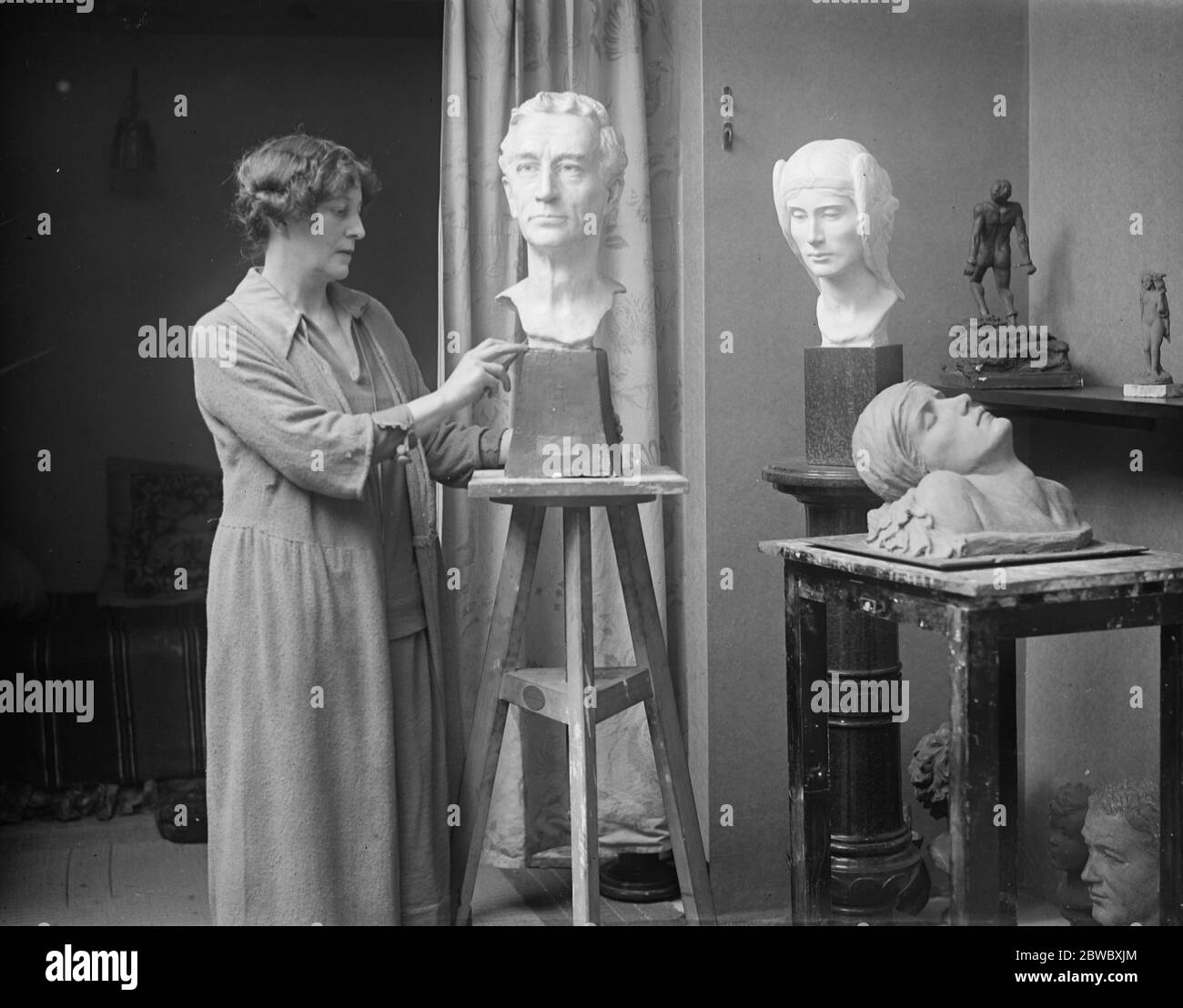 Titled sculptress to give unique dinner . Lady Welby , the talented sculptress , is shortly giving a dinner which will be a novelty even in art circles . All the guests to be invited have sat to her for their busts . Lady Welby in her London studio . 12 November 1925 Stock Photo