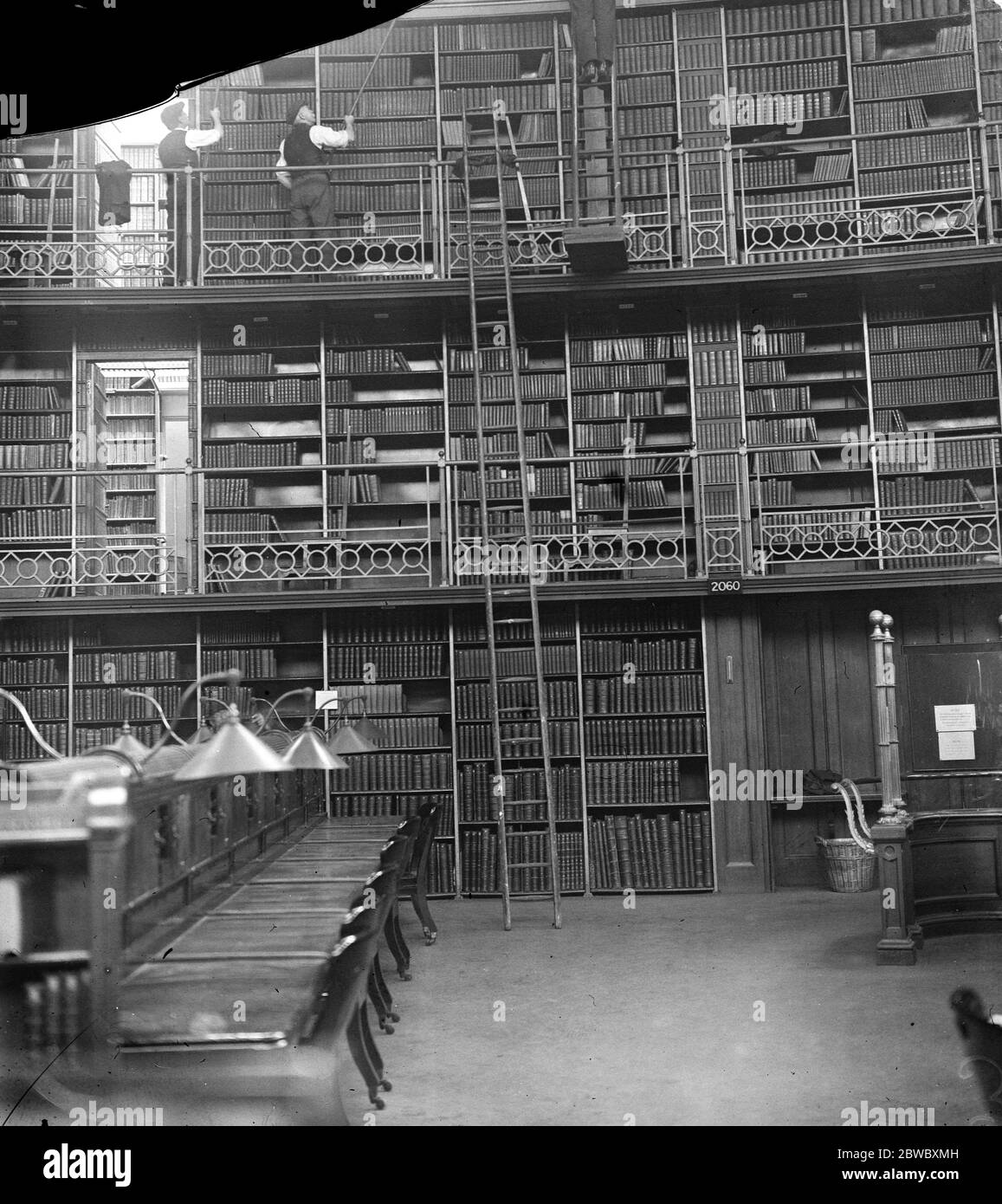 The gentlemen with the dusters . Millions of books being overhauled at the British museam Millionsof books in the iron room and reading room of the British museam are now being dusted , overhauled , repaired and checked 1 September 1924 Stock Photo