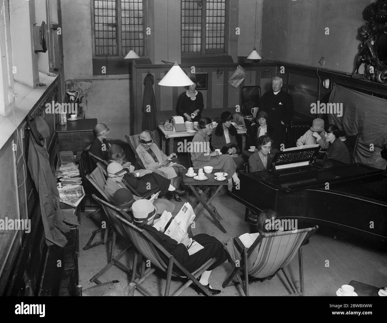Good work at a threatened city church . At St Vedast , Foster lane , one of the 19 city churches scheduled for demolition , a featue of the parochial activities is the luncheon hour rest room . Best hour at St Vedast . 26 July 1926 Stock Photo