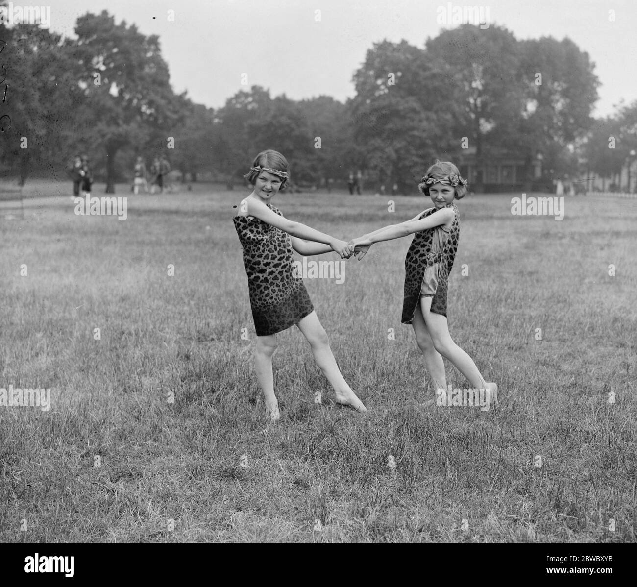 LEague of Arts dancing in Hyde Park . Little Mary and Ann Casson , daughters of Miss Sybil Thorndike , photographed in a dance which formed part of the League of Arts entertainment in Hyde Park . 20 June 1925 Stock Photo