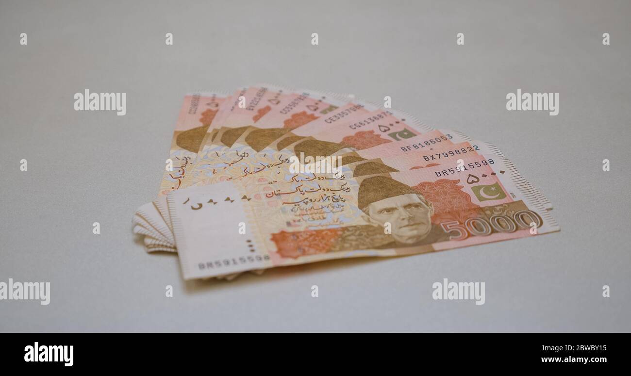 5000 Rupees Pakistani currency notes with white background Stock Photo