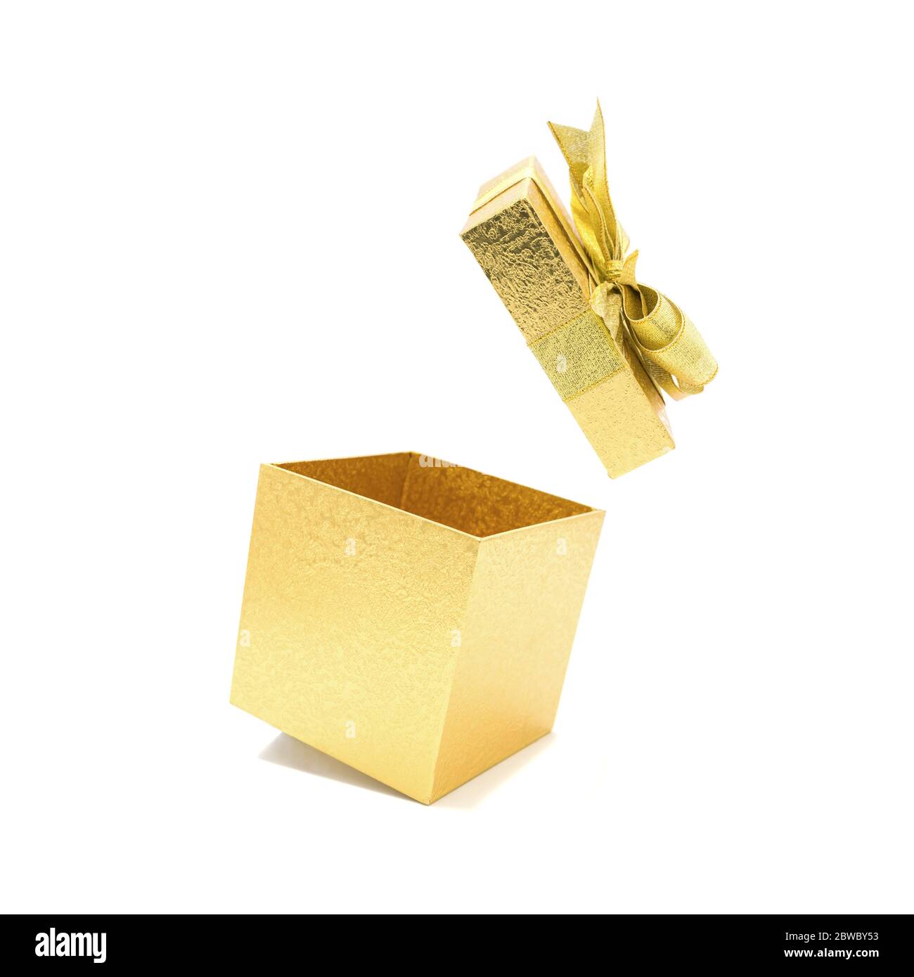 Open empty gold gift box isolated on white background. Stock Photo
