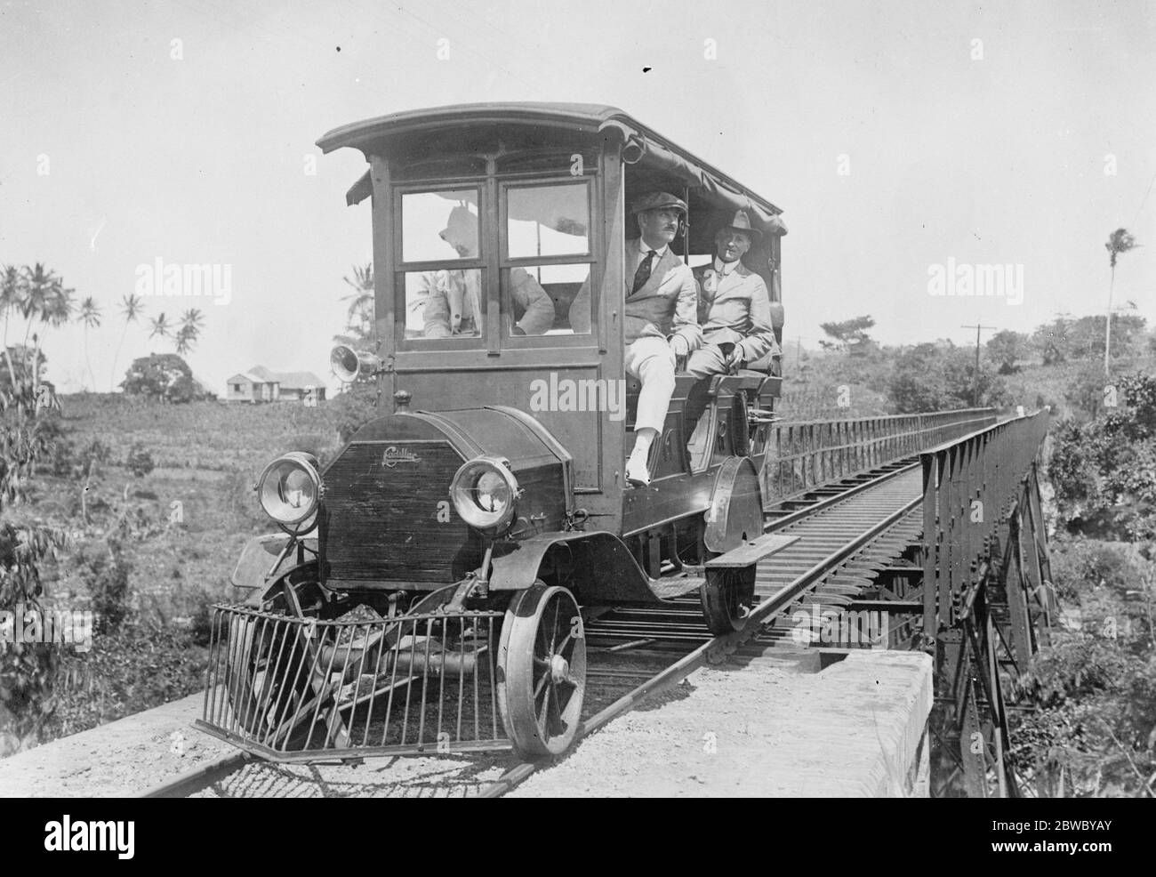 Where motor cars run on rails . An interesting picture from Porto Rico , showing a Cadillac car , fitted with special wheels , running on a local light railway . 2 March 1925 Stock Photo