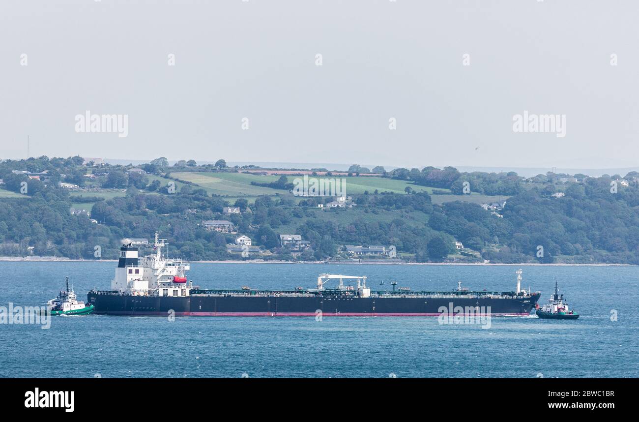 Cork Harbour, Cork, Ireland. 31st May, 2020. Oil tanker Kerala with a cargo of crude oil from Nigeria is maneuvered by tugboats DSG Titan and DSG Alex before docking at the jetty at the Whitegate Oil Refinery in Cork Harbour, Ireland. Since the outbreak of the Covid-19 pandemic demand for oil has slumped on international markets which has resulted in a shortage of storage capacity worlwide. - Credit; David Creedon / Alamy Live News Stock Photo