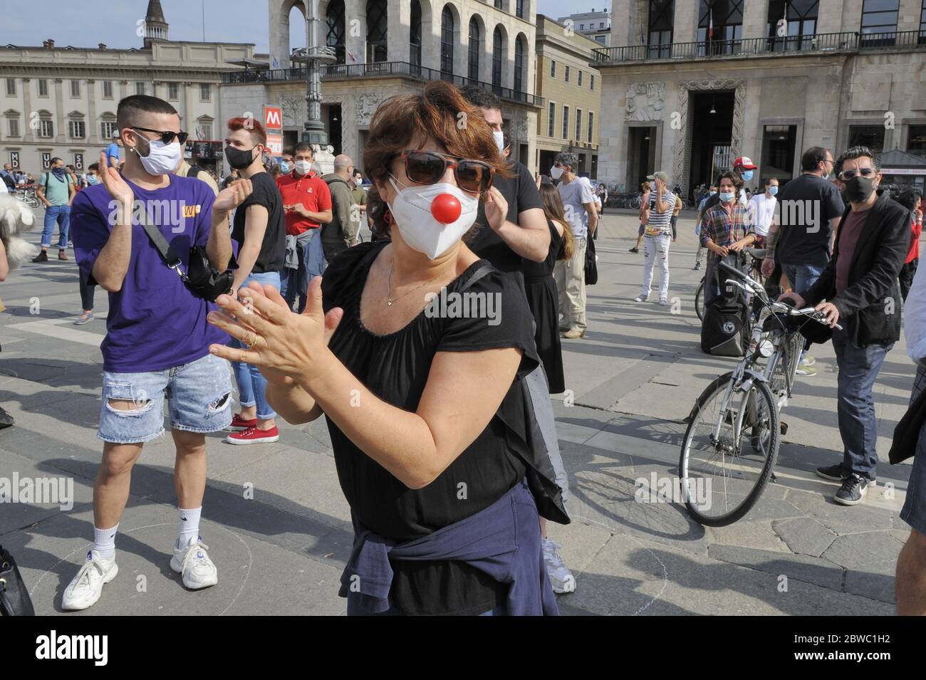 Italy, national mobilization of entertainment workers, event in Milan; there are tens of thousands throughout Italy, not only artists, but also workers, builders, carpenters, sound engineers, make-up artists, woodworkers, set designers, and a hundred other professions, not forgetting the street jugglers, working for the cinema, theater, television, outdoor music concerts, have suffered a severe economic crisis due to the Coronavirus epidemic, and still await economic aid from the State. Stock Photo