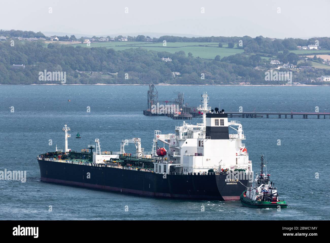 Cork Harbour, Cork, Ireland. 31st May, 2020. Oil tanker Kerala with a cargo of crude oil from Nigeria is escorted by tugboat DSG Titan as she approaches the jetty at the Whitegate oil Refinery in Cork Harbour, Ireland. Since the outbreak of the Covid-19 pandemic demand for oil has slumped on international markets which has resulted in a shortage of storage capacity worlwide. - Credit; David Creedon / Alamy Live News Stock Photo