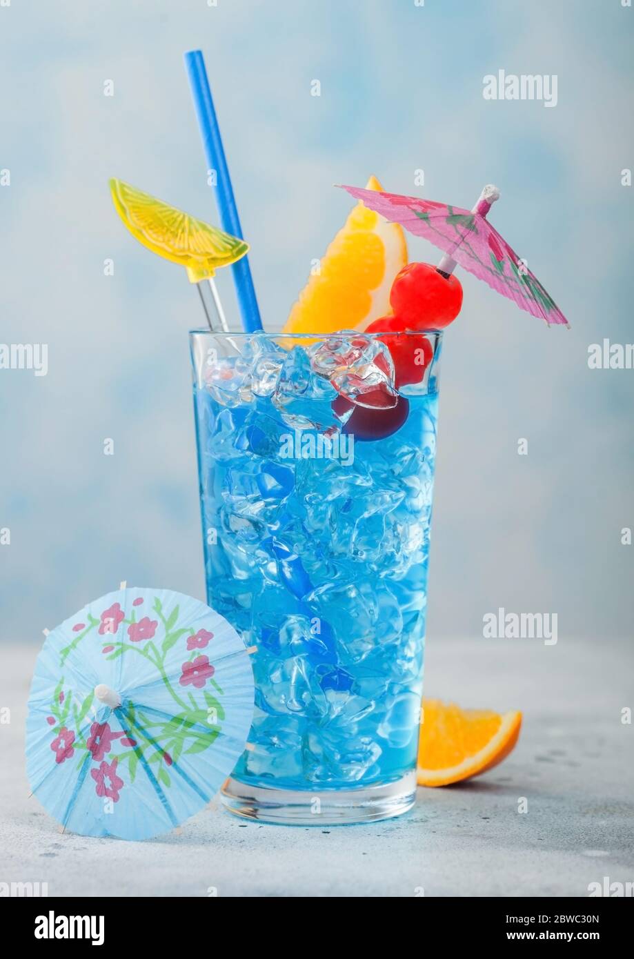 Blue lagoon summer cocktail in highball glass with sweet cocktail ...