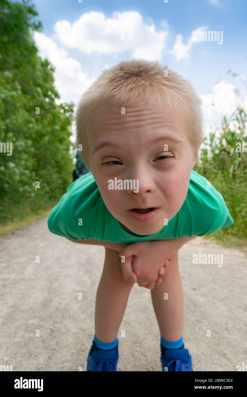 Boy with down syndrome hires stock photography and images Alamy