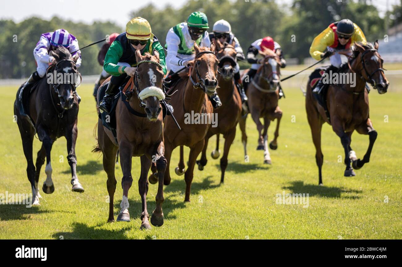 Hoppegarten, Germany. 31st May, 2020. Horse racing: Gallop, Hoppegarten Racetrack, second day of racing. Jockey Clement Lecoeuvre wins group race on Kalifornia Queen from the stable at Gestüt Röttgen Diana-Trial. Due to the coronavirus pandemic, the races are held without spectators. Credit: Andreas Gora/dpa/Alamy Live News Stock Photo