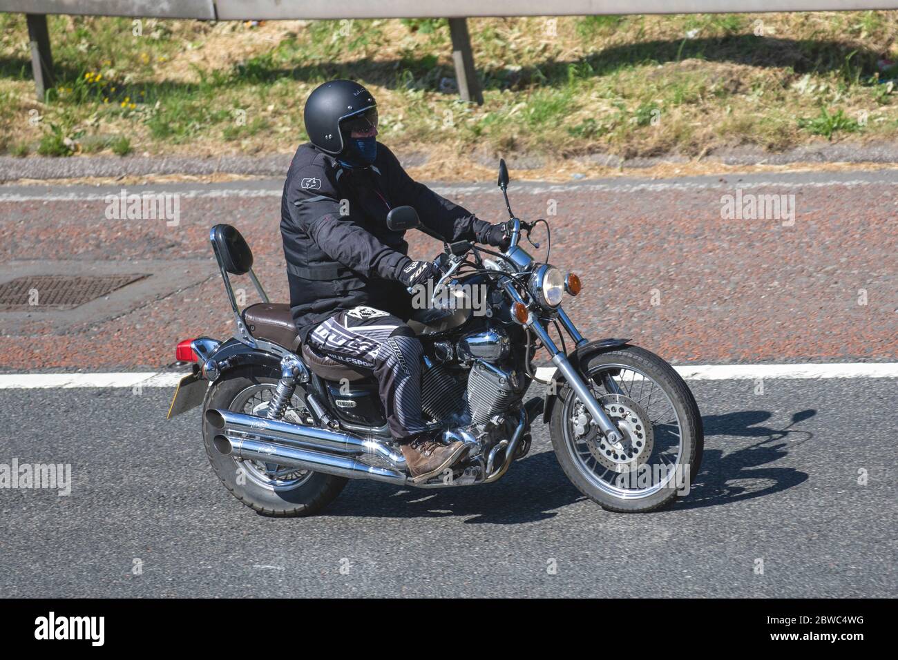Yamaha Virago; Motorbike rider; two wheeled transport, motorcycles, vehicle, roads, motorbikes, bike riders motoring on the M6 motorway Chorley, UK Stock Photo