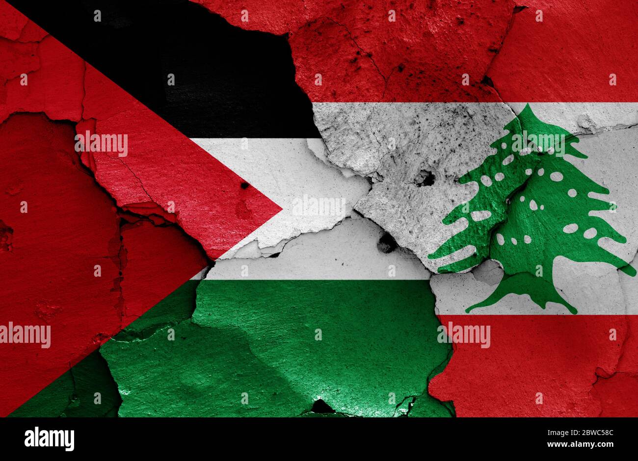 flags of Palestine and Lebanon painted on cracked wall Stock Photo