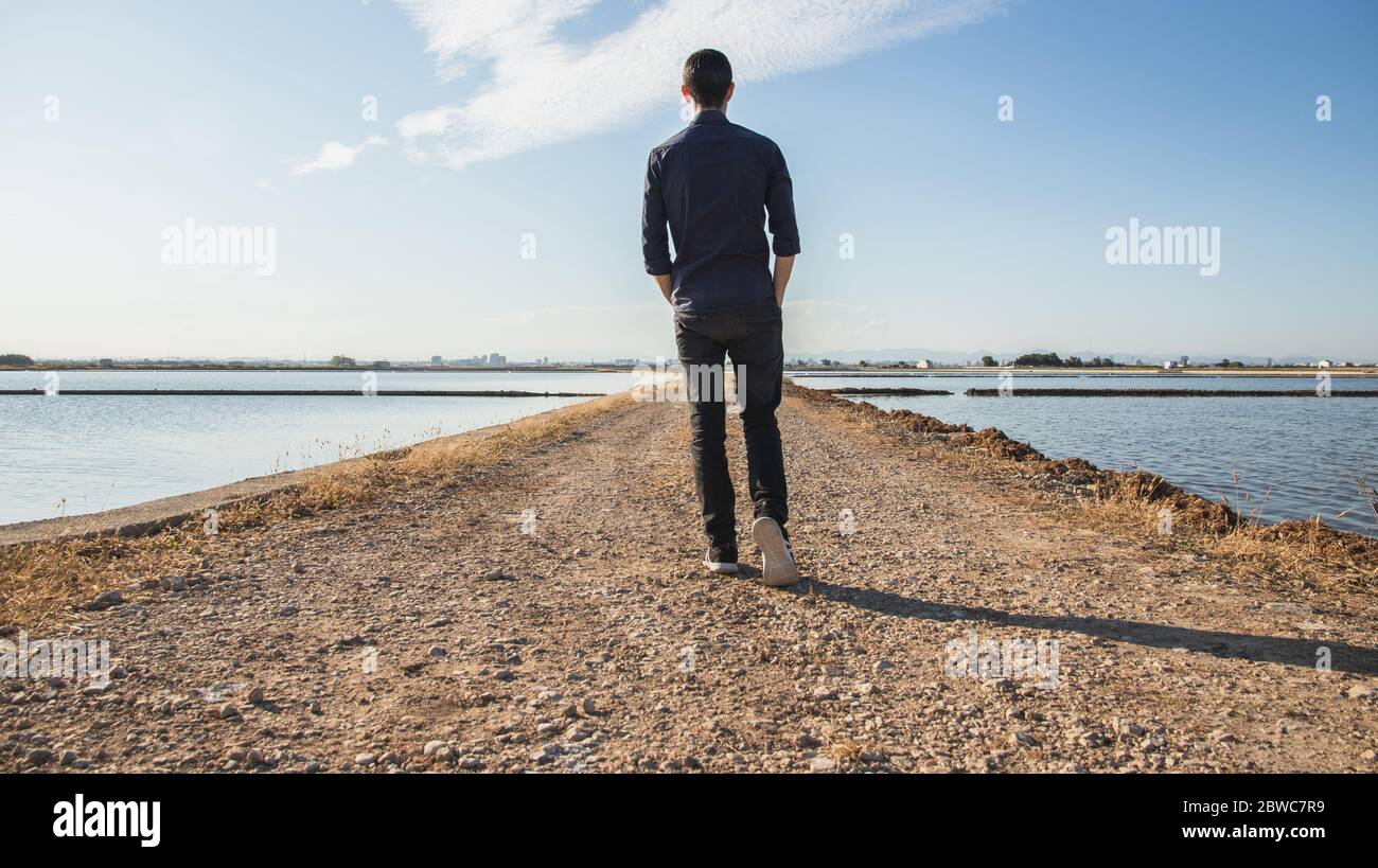Back view walking handsome young hi res stock photography and images