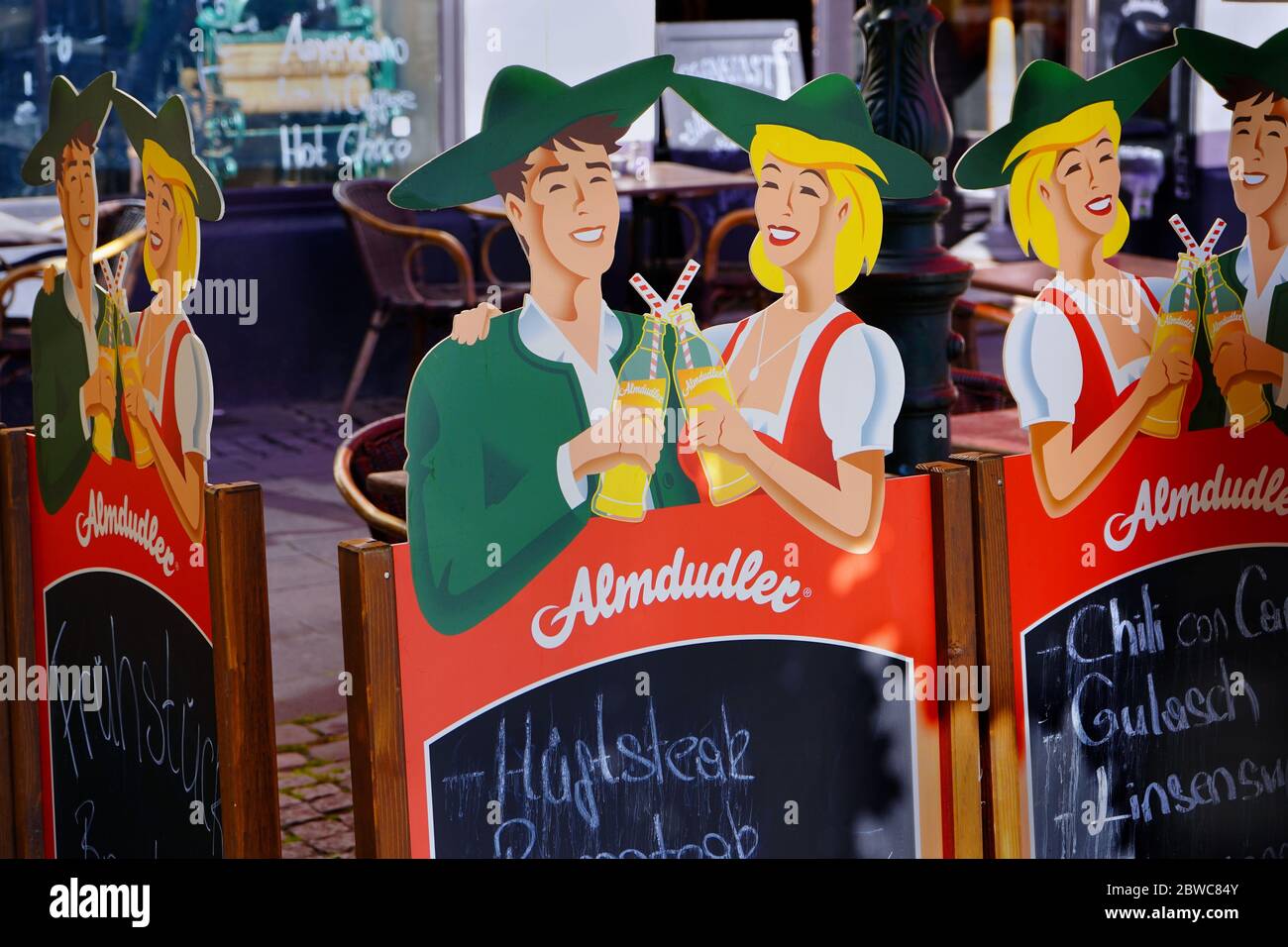 Advertisement in front of a restaurant in Düsseldorf Old Town, which is a popular tourist area with many restaurants and bars located near Rhine river. Stock Photo