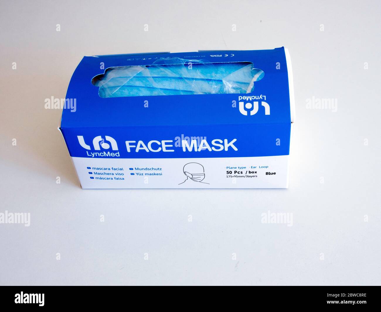 A box of fifty face covering masks made by Italian company Lyncmed in demand during the Coronavirus pandemic on a white background Stock Photo