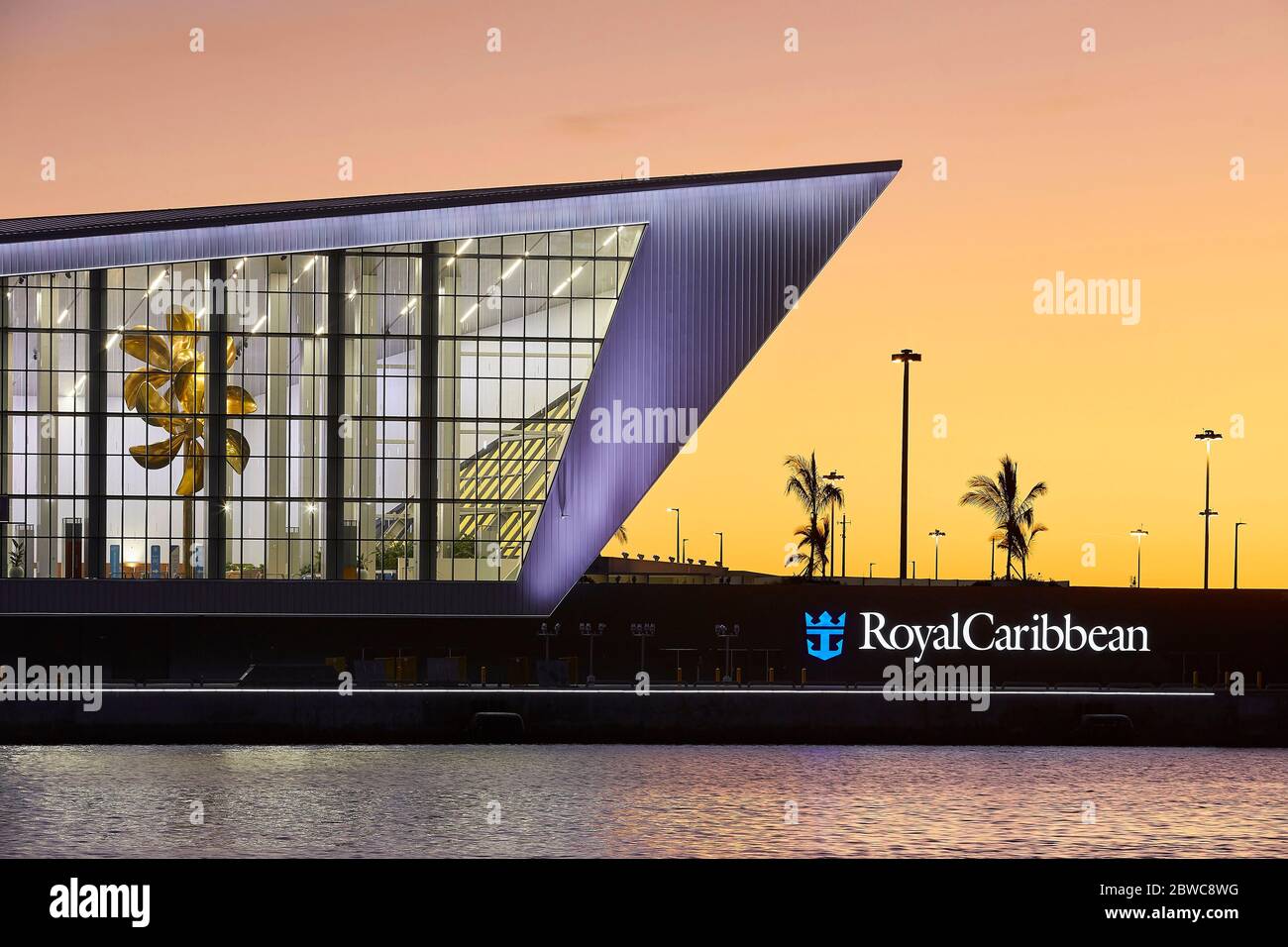 Exterior facade at sunset. Royal Caribbean Miami Cruise Terminal, Miami, United States. Architect: Broadway Malyan Limited, 2019. Stock Photo