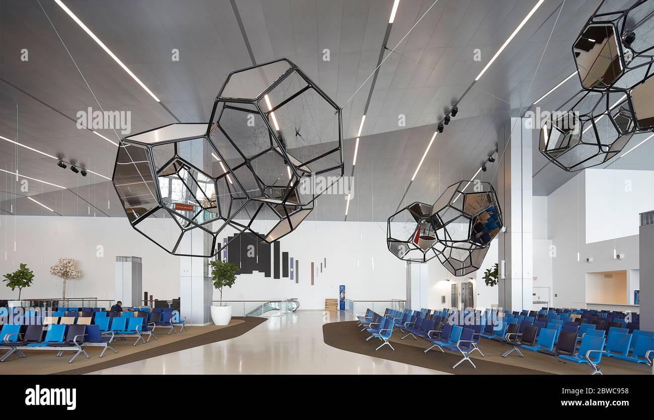 Interior view of waiting area. Royal Caribbean Miami Cruise Terminal, Miami, United States. Architect: Broadway Malyan Limited, 2019. Stock Photo