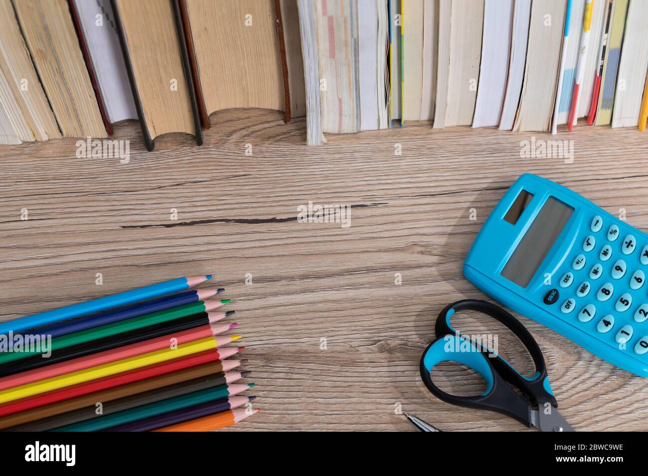 New school supplies. Books arranged in a row. Equipment for every