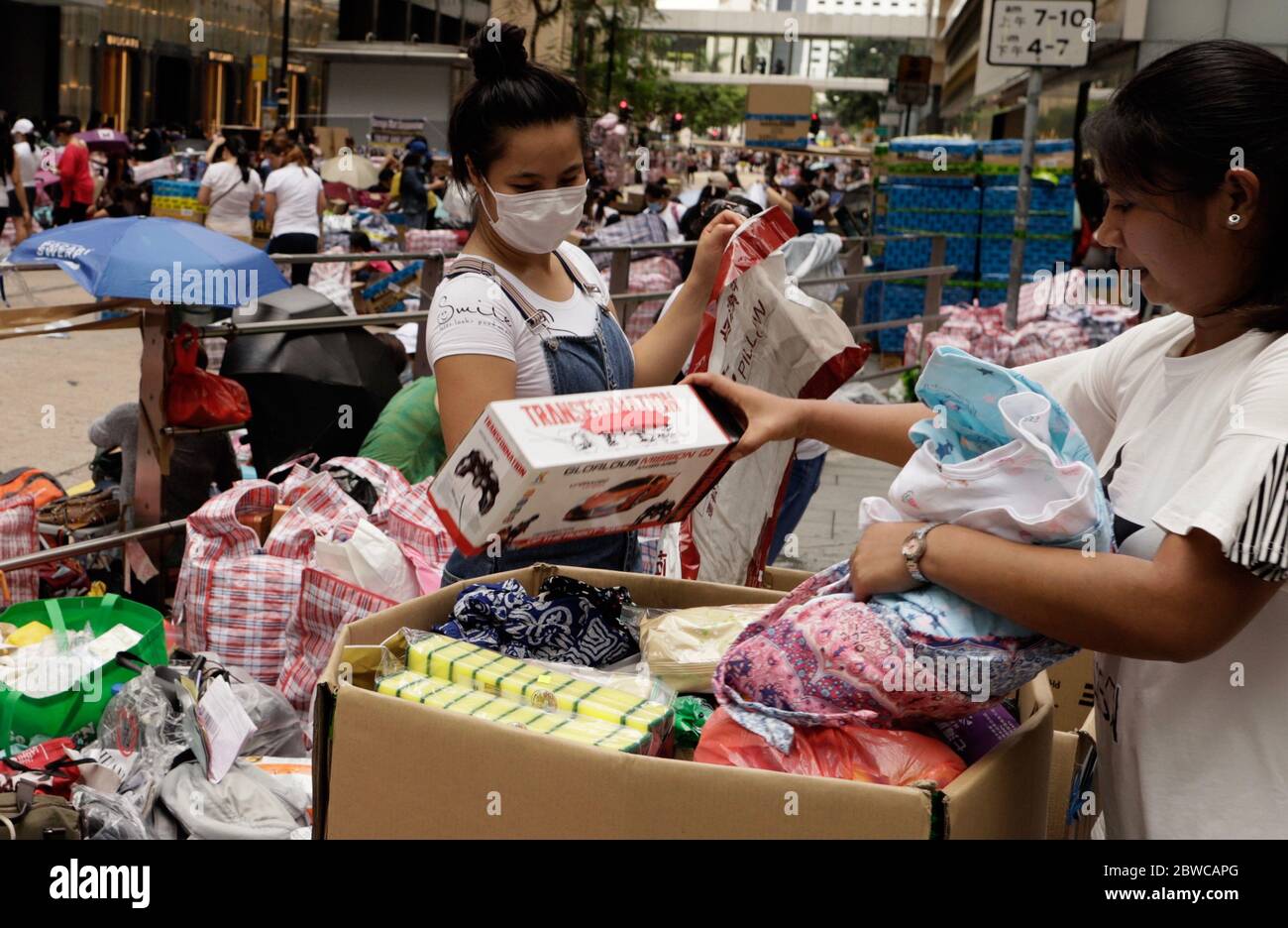 hong-kong-china-31st-may-2020-domestic-helpers-pack-up-daily-necessities-ready-to-deliver-parcels-to-the-families-in-the-philippines-on-sunday-oversea-workers-in-hong-kong-particularly-filipinos-are-frequently-sending-daily-necessities-to-their-homelands-to-support-their-families-who-comes-from-lower-stratum-of-societymay-31-2020-hong-kongzumaliau-chung-ren-credit-liau-chung-renzuma-wirealamy-live-news-2BWCAPG.jpg