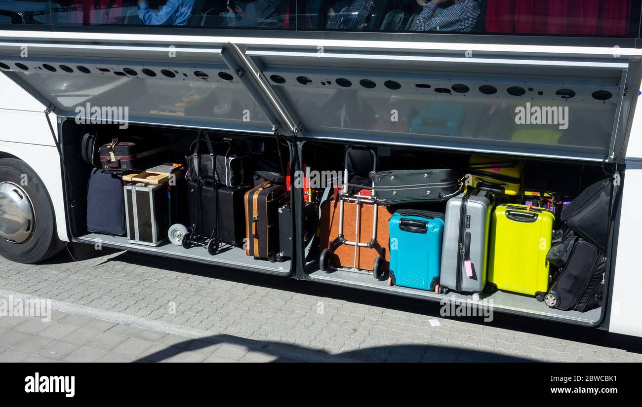 Travel suitcases in the luggage compartment of a passenger bus Stock