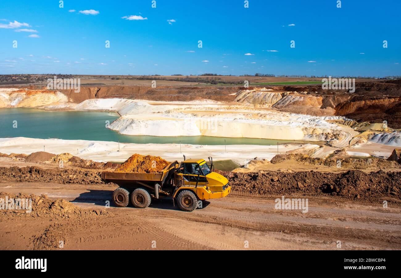 Big truck works at quartz sand quarry Stock Photo