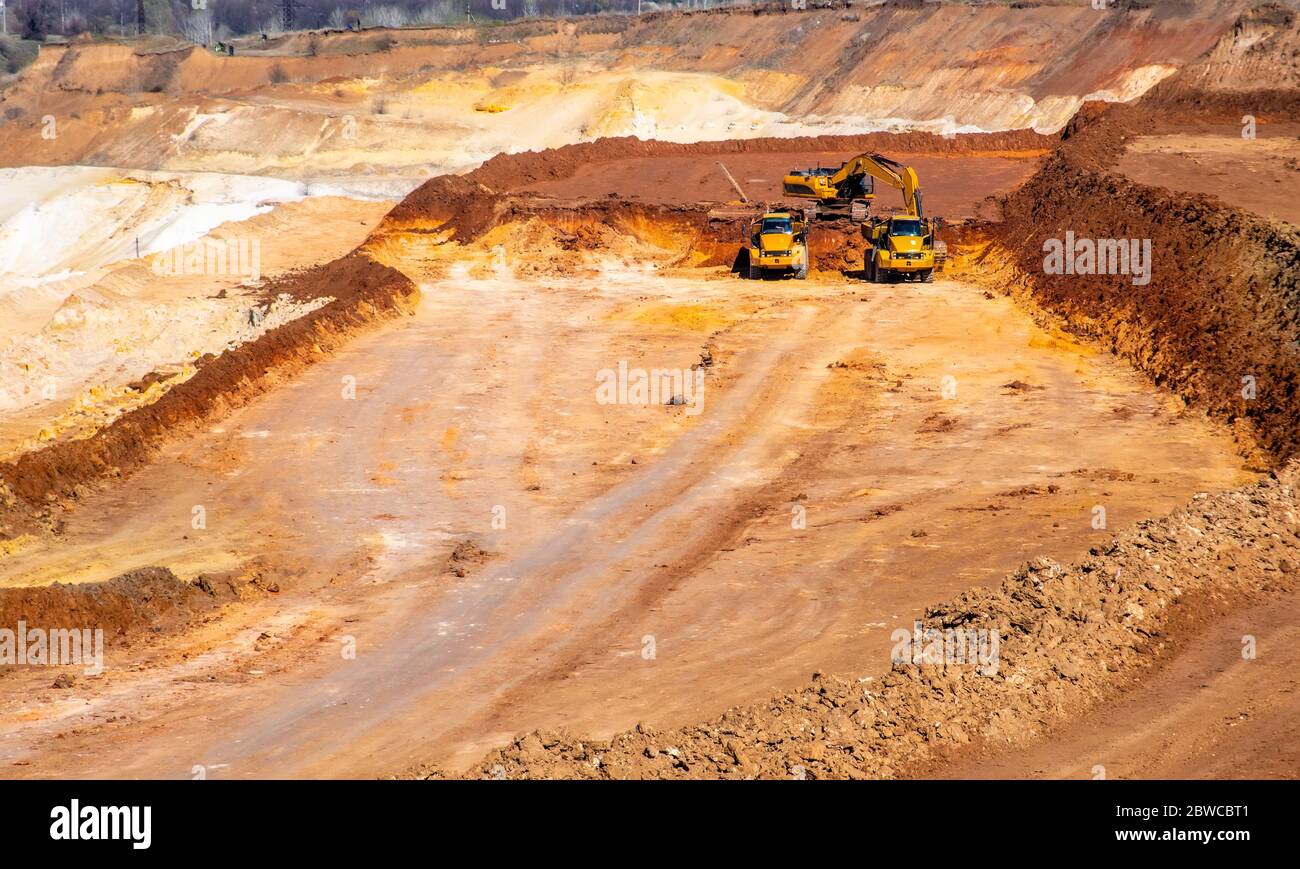 Big truck works at quartz sand quarry Stock Photo