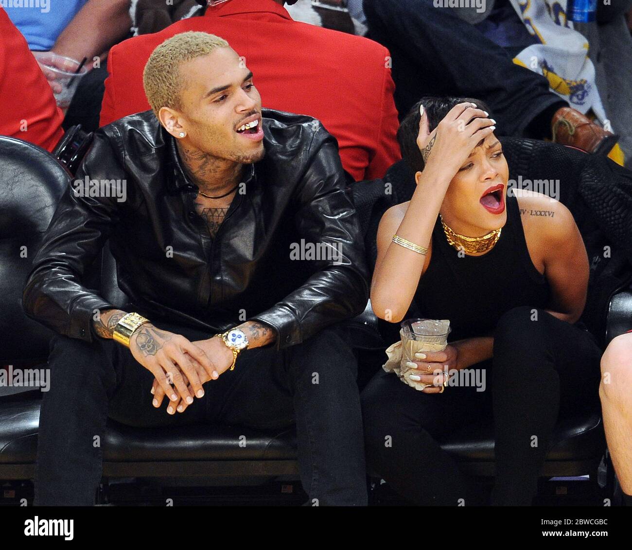 Rihanna, Chris Brown laughing together at LA Lakers NBA game, December 2012  Stock Photo - Alamy