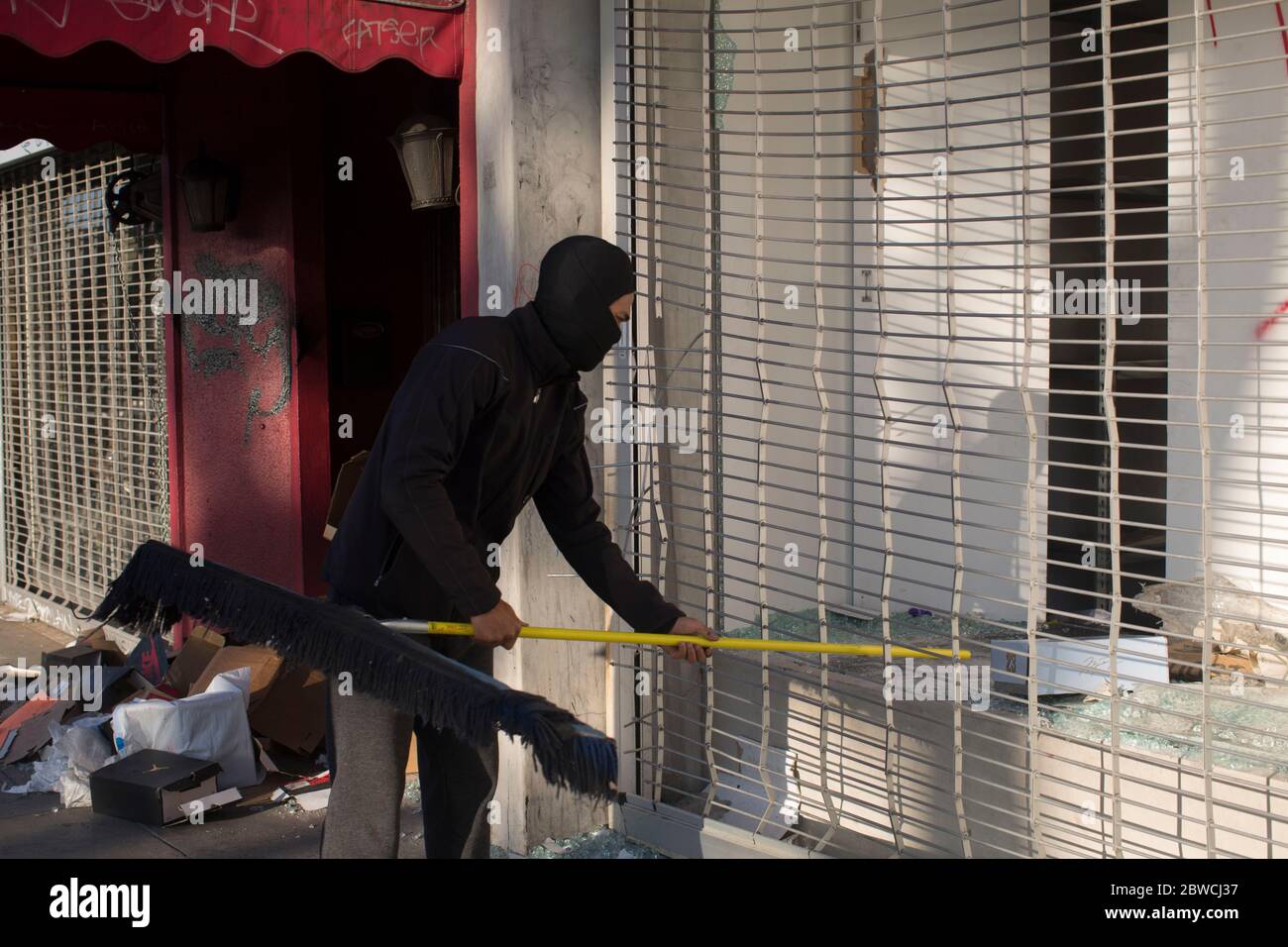 May 31, 2020, Los Angeles, California, USA: Store Owner Kaz clean his Store on Fairfax Ave a day after Protesters loot a shop during a protest over the death of George Floyd, a handcuffed black man in police custody in Minneapolis, in Los Angeles, Sunday 31, May, 2020.Established in New York City over fifteen years ago, Flight Club revolutionized sneaker retail as the original consignment store for rare shoes. Carrying the rarest exclusives and collectible sneakers, Flight Club has evolved from a one-stop sneaker destination, to a cultural hub for sneaker enthusiasts and novices alike. (Cred Stock Photo