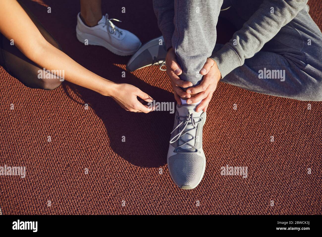 Knee injury in training.Man injured his leg during exercise. Stock Photo