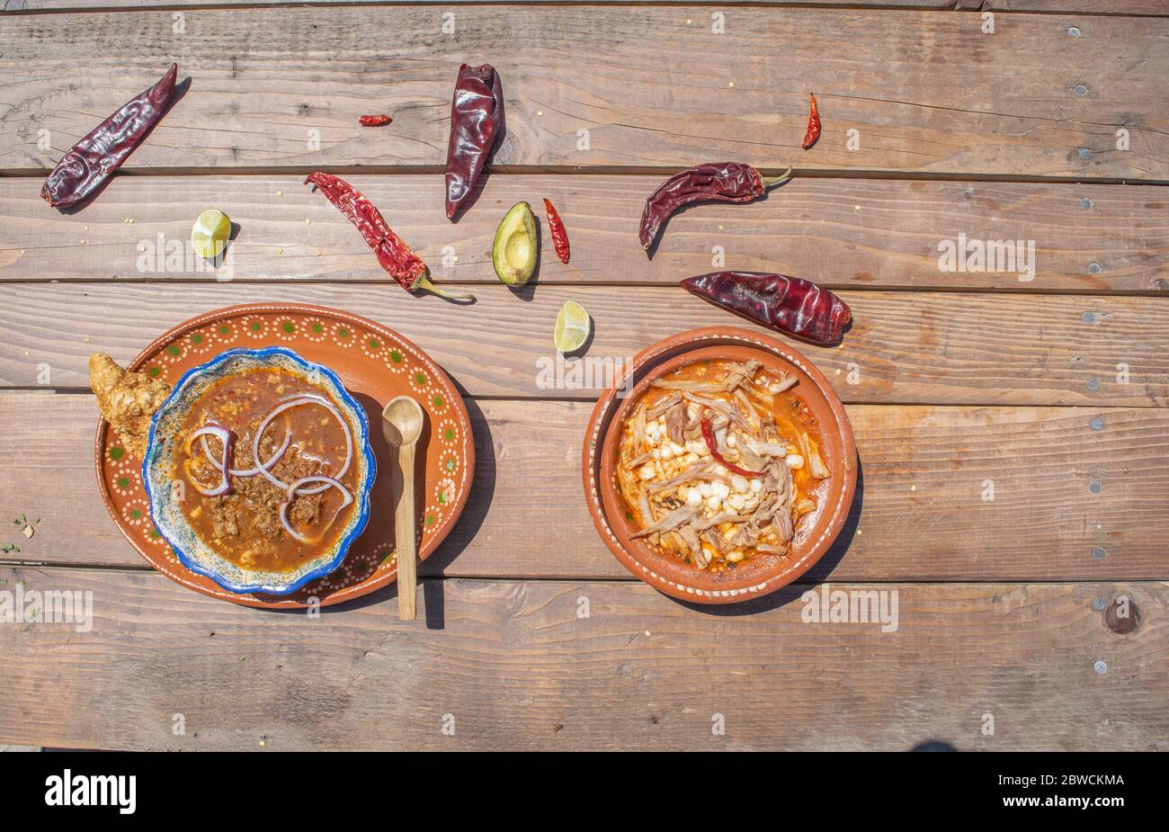 top view Mexican food, plate of birria and pozole with sauce and