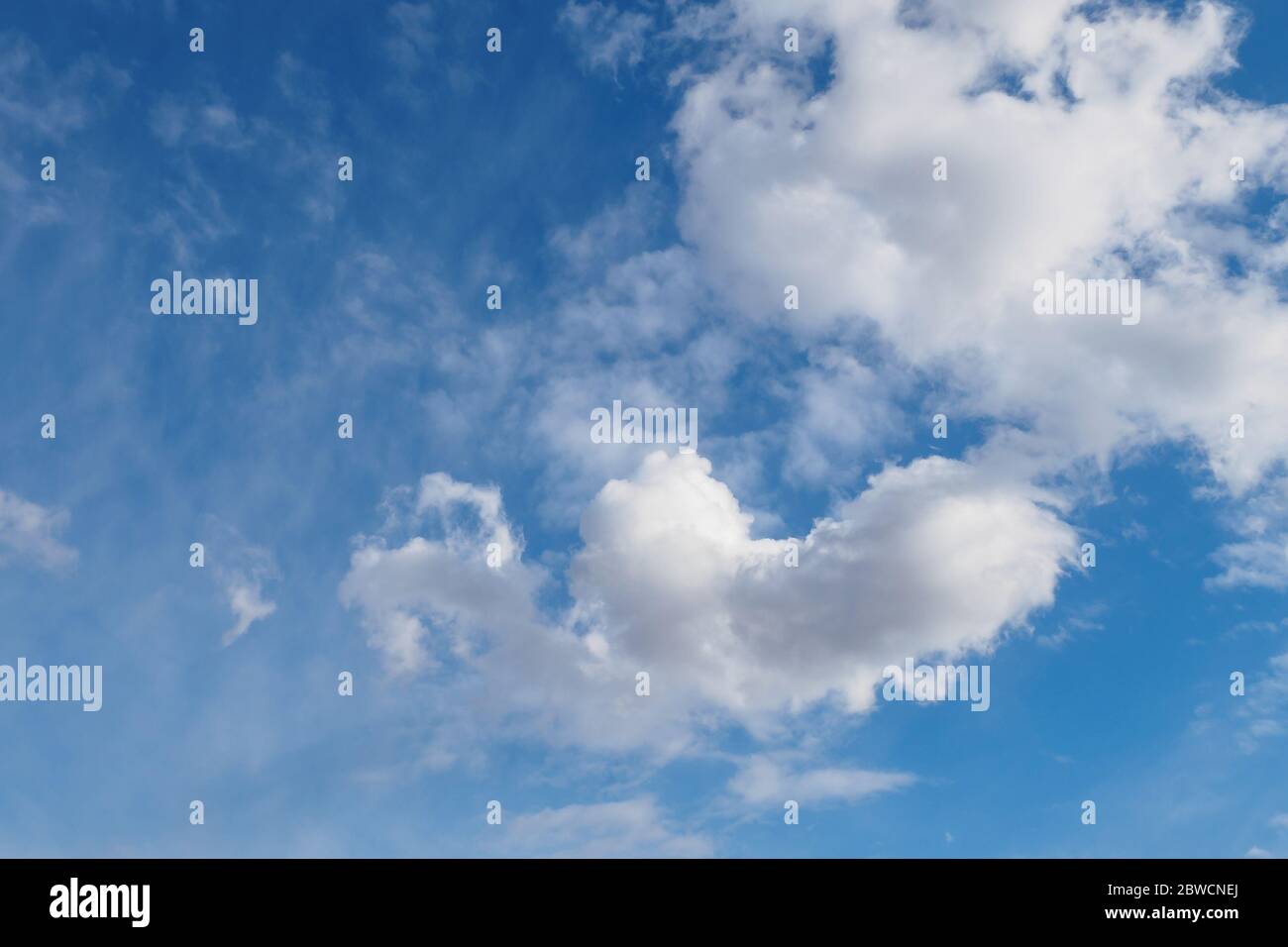 Cumulus clouds on blue sunny spring sky, nature background Stock Photo