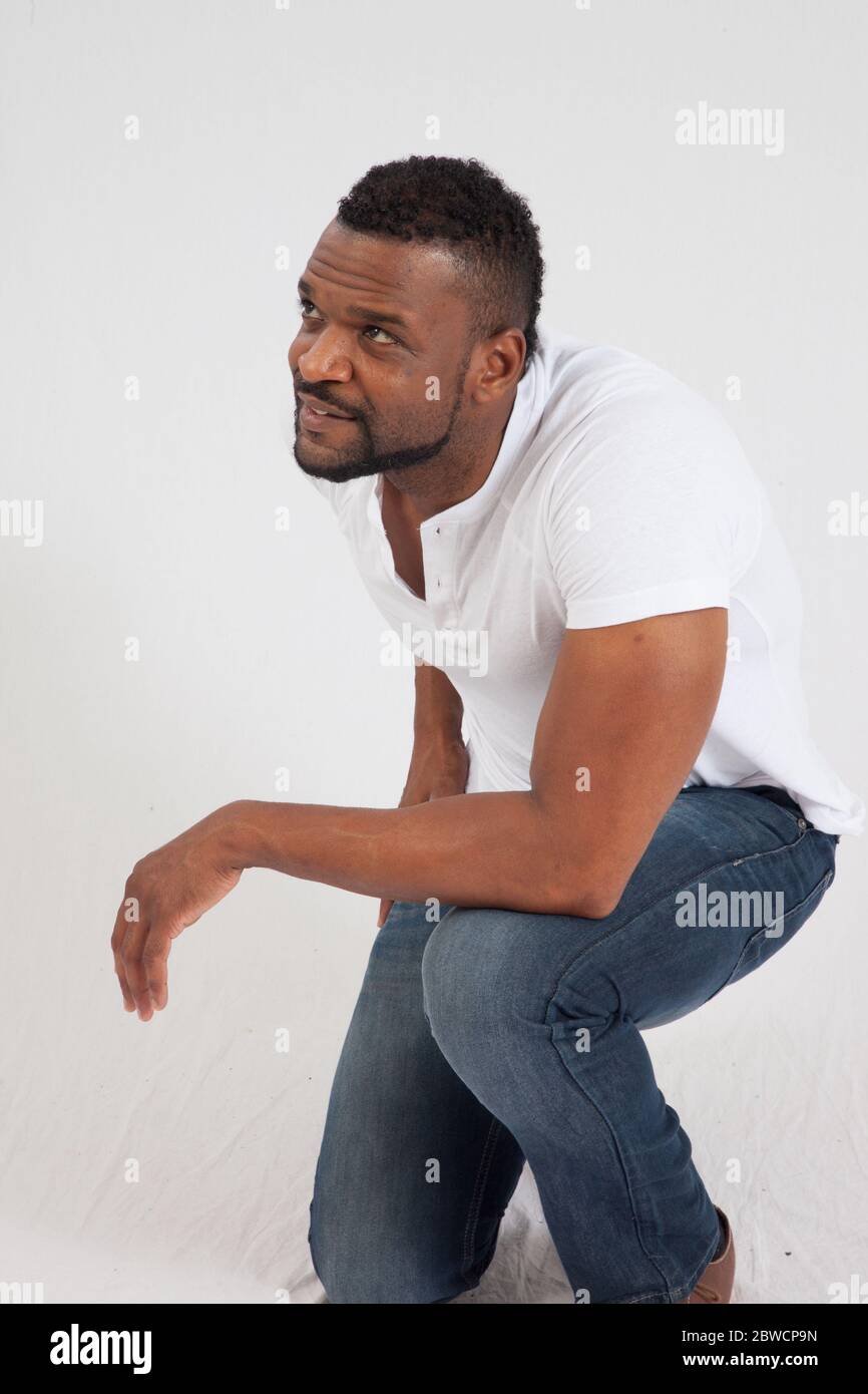 Kneeling man hi-res stock photography and images - Alamy