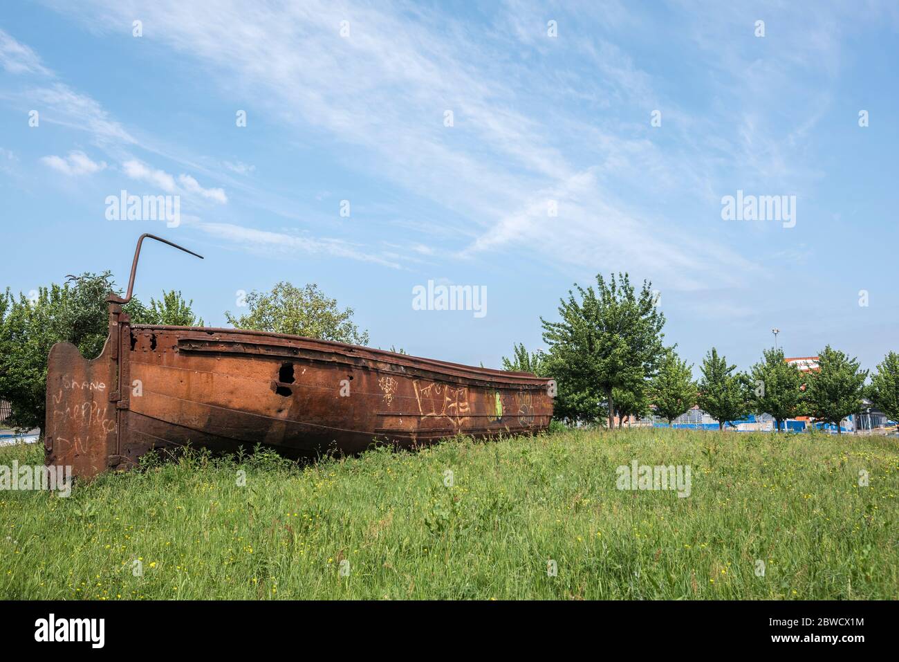 Old rusting industrial Scow boat relic close to Forth & Clyde canal, Glasgow. Stock Photo
