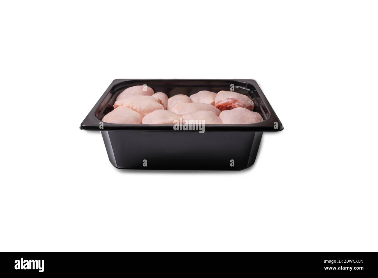 Vacuum packaging.Chicken legs in red marinade in plastic packaging for