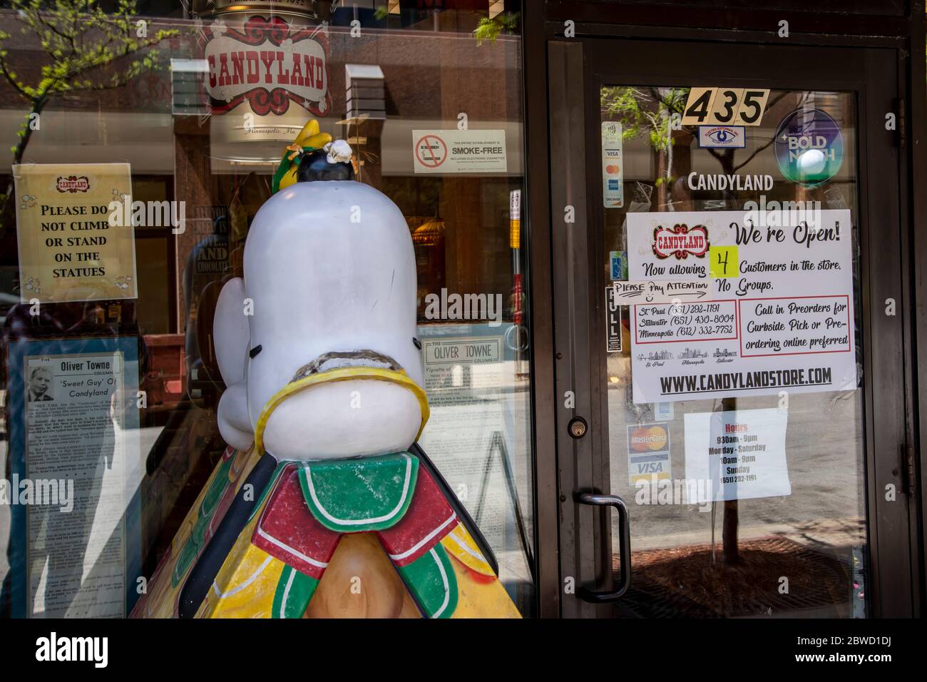 St. Paul, Minnesota. The Candyland store in downtown with a sign on the door that says only four people at a time allowed in the store and no groups. Stock Photo