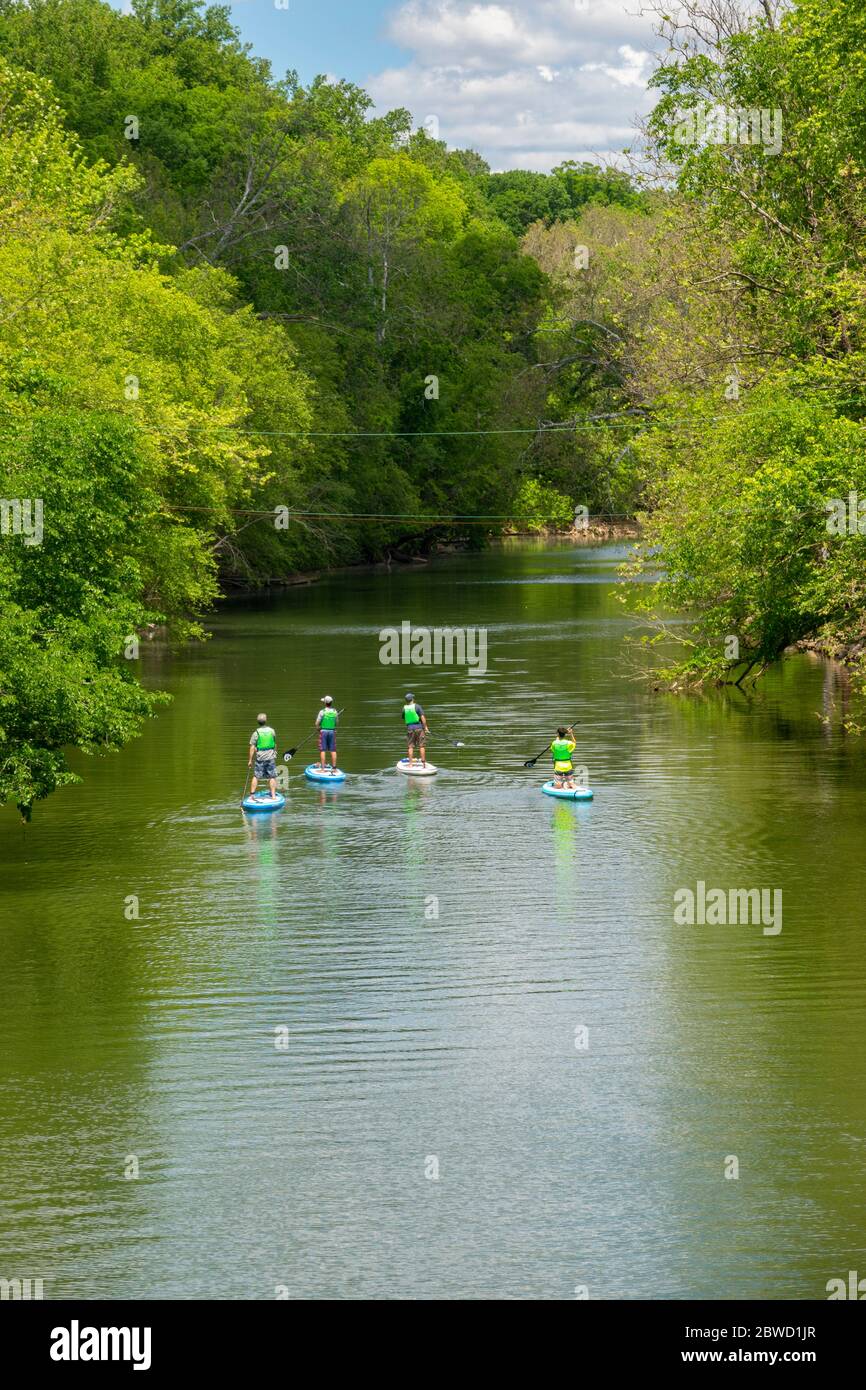 USA Maryland MD Outdoors recreation stand up paddle boarding on Seneca Creek in Poolesville Montgomery County Stock Photo