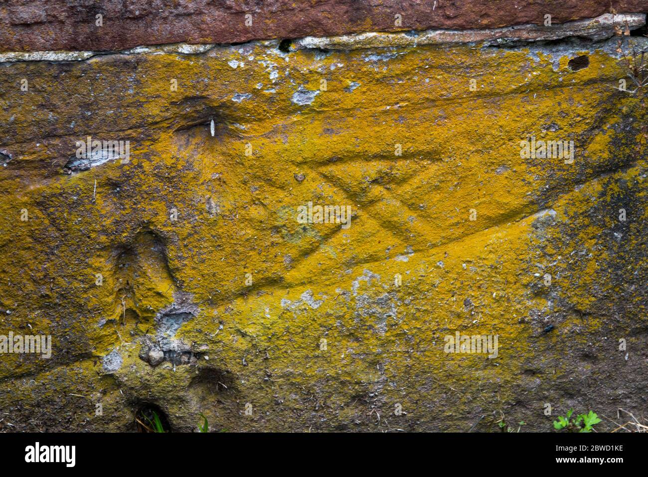 USA Maryland C & O Canal Rileys Lock  Masons Mark cut into red sandstone by the stone cutter in the mid 1800s Stock Photo