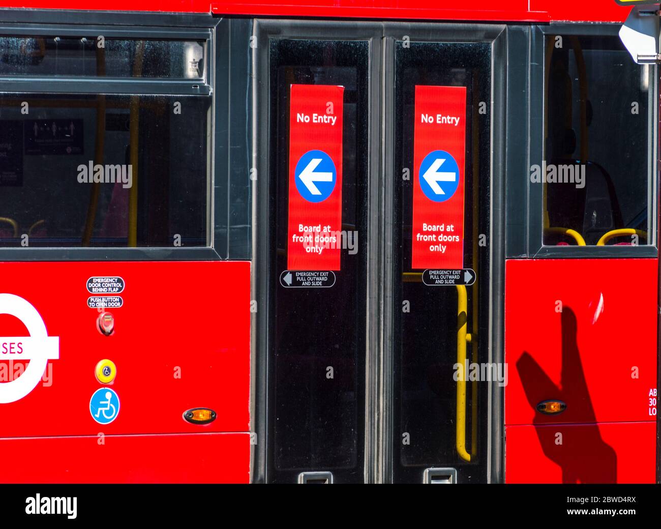 London bus operated by TFL rolling back Coronavirus changes to board the bus in front and pay Stock Photo