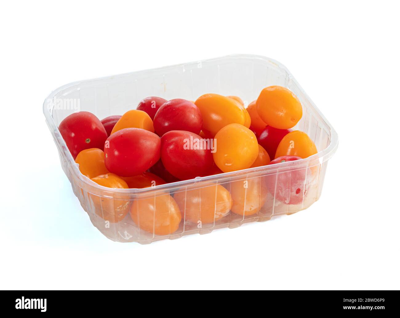 Download Red And Yellow Cherry Tomatoes In A Transparent Tray On A White Background Stock Photo Alamy Yellowimages Mockups