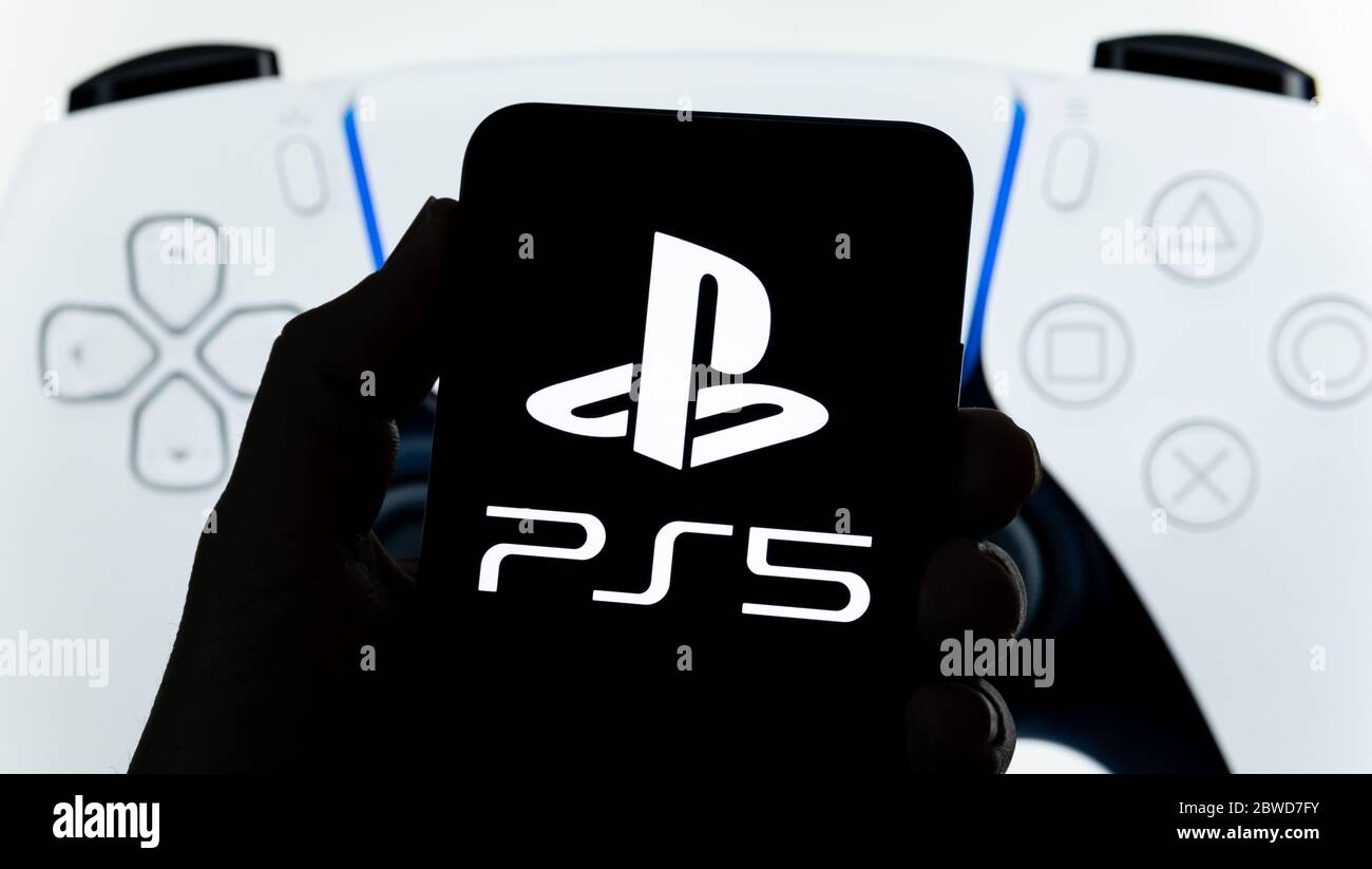 Stone /United Kingdom - May 28 2020: Sony PS5 logo seen on smartphone and  official PS5 DualSense controller on the blurred screen at the background. R  Stock Photo - Alamy