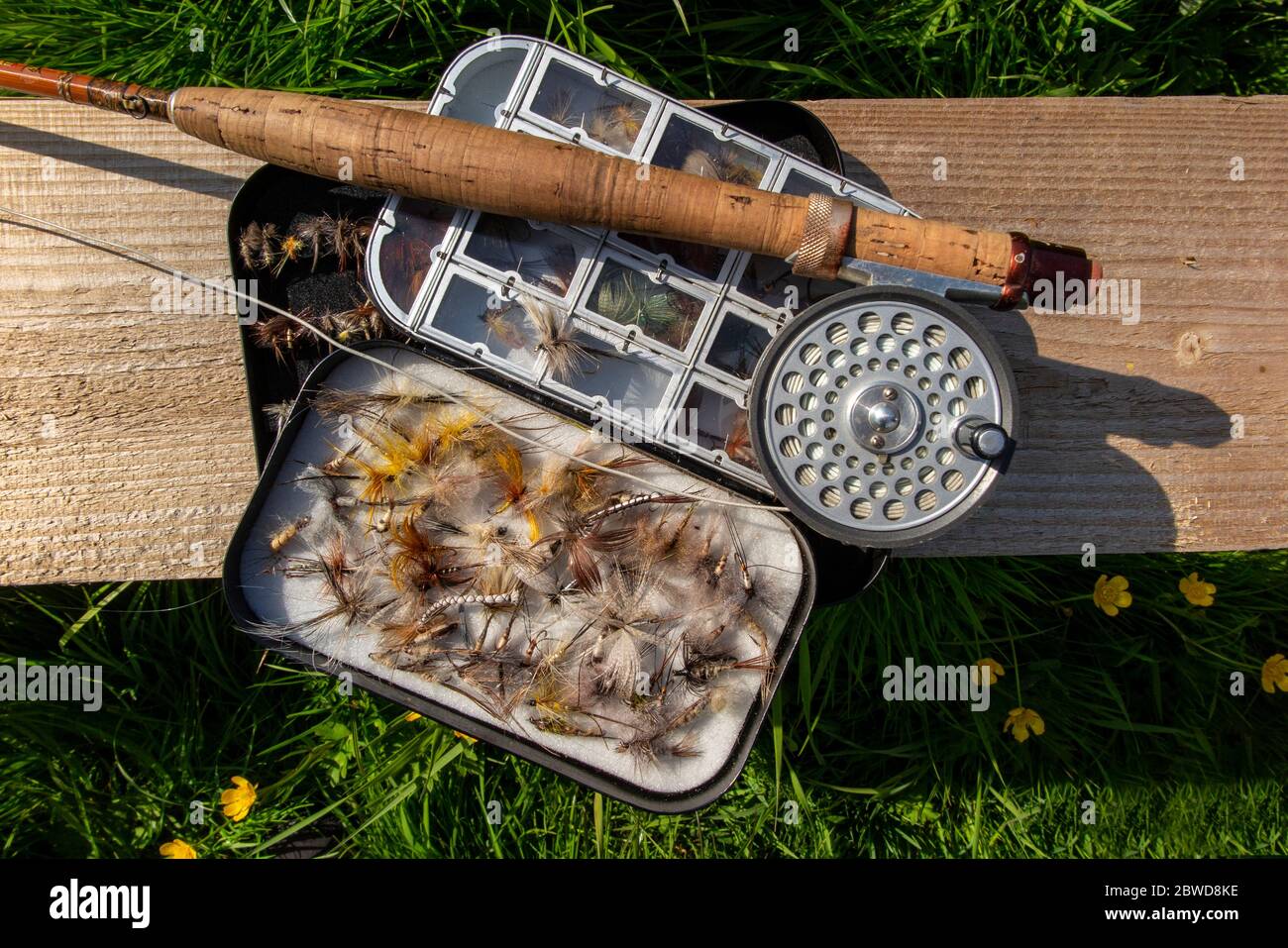 A traditional split cane fly fishing rod with an aluminium box of