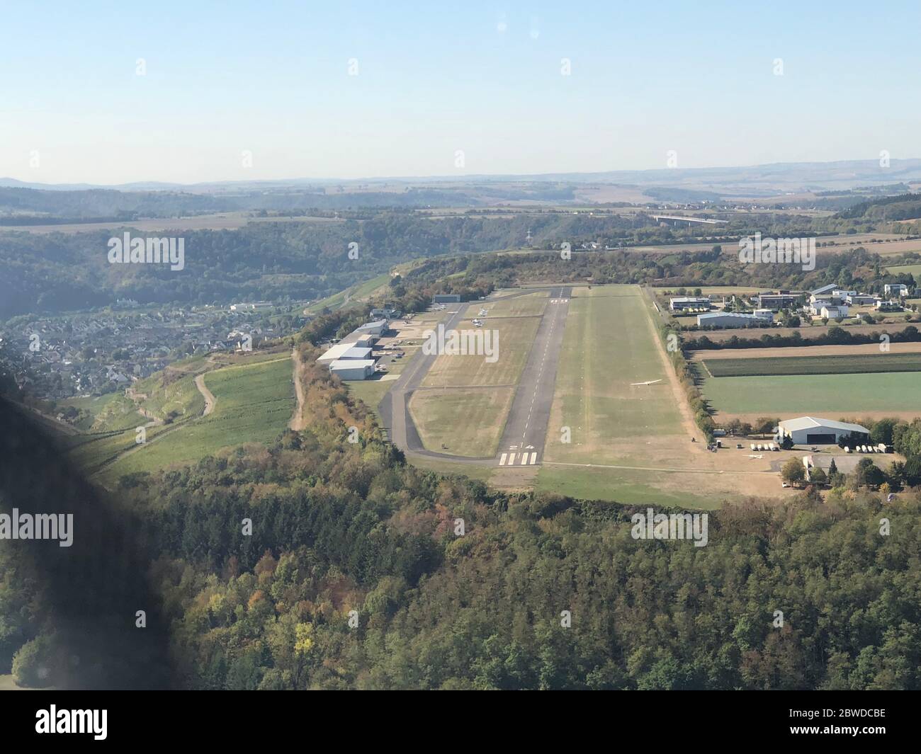 Approaching a runway strip with a propeller plane Stock Photo