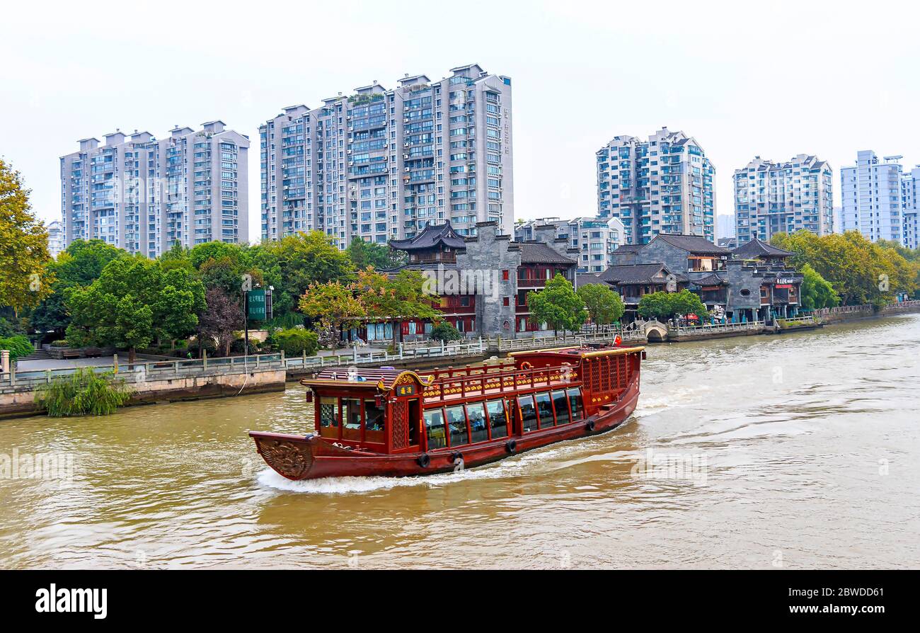 The Grand Canal in Hangzhou, China. It is the longest canal or artificial river in the world and a famous tourist destination. Starting at Beijing, it Stock Photo