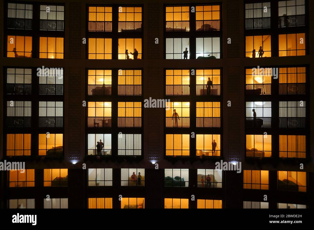 Miniature apartment building house at night in city Stock Photo