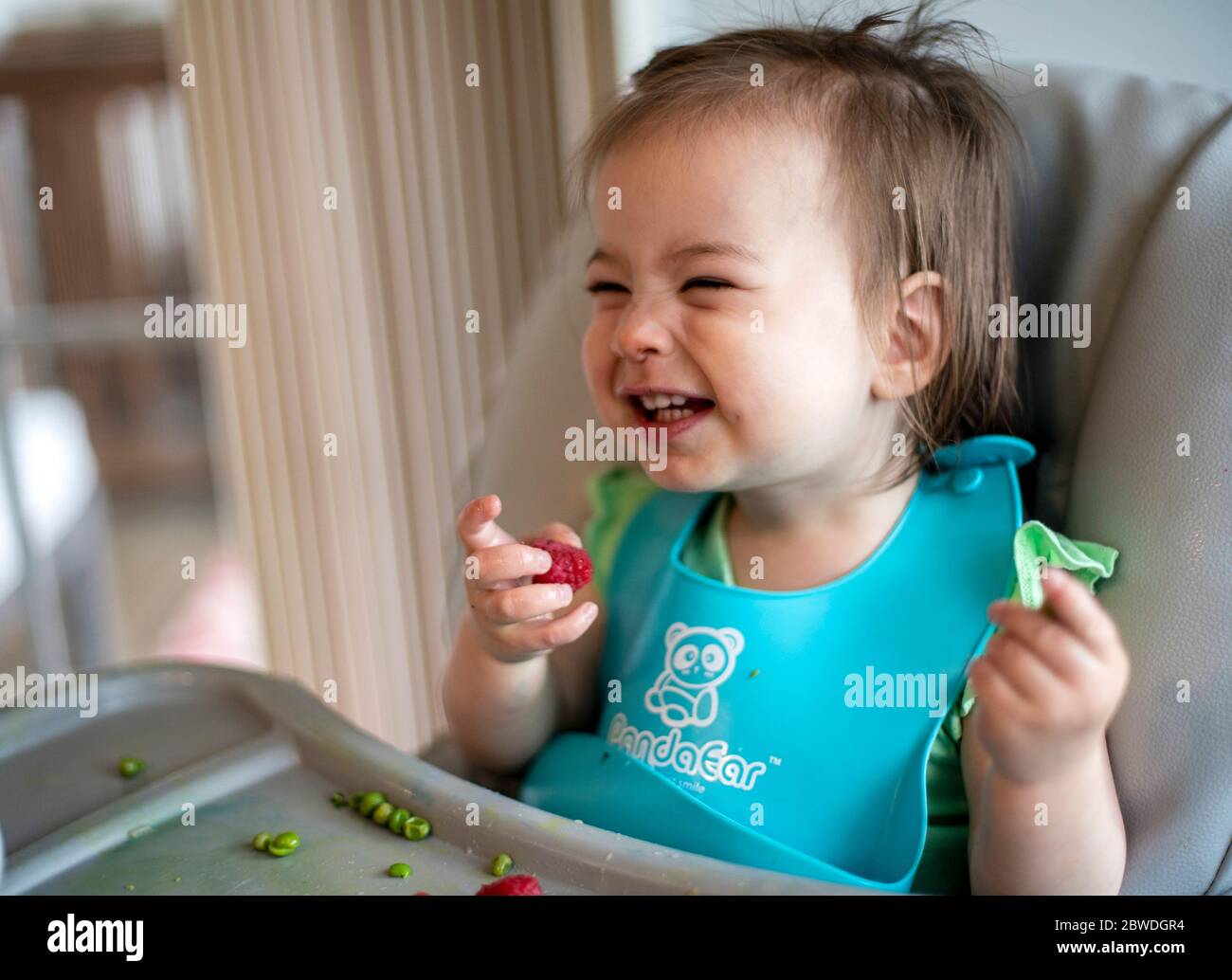 A big giggle from a little girl Stock Photo - Alamy