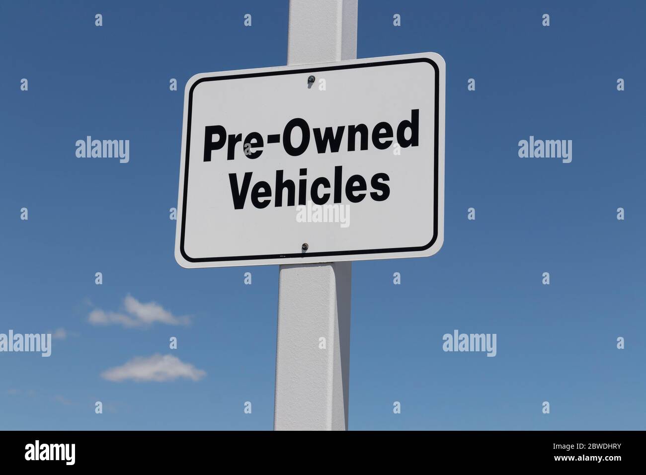 Pre Owned Vehicles sign at a Used Car Dealership. Stock Photo