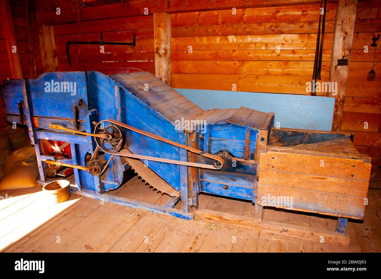 Old-Fashioned Wooden Grain Thresher Machine Stock Photo